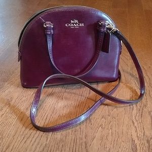 Coach curved top crossbody wine colored minibag